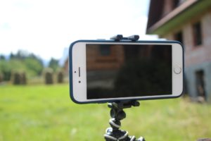 a phone tripod holding a phone